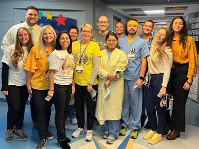 JSUMC Pediatric residences gathering in the hospital hallway.
