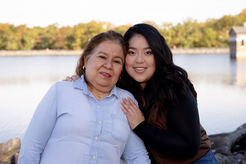 Esperanza and her daughter smiling and hugging.